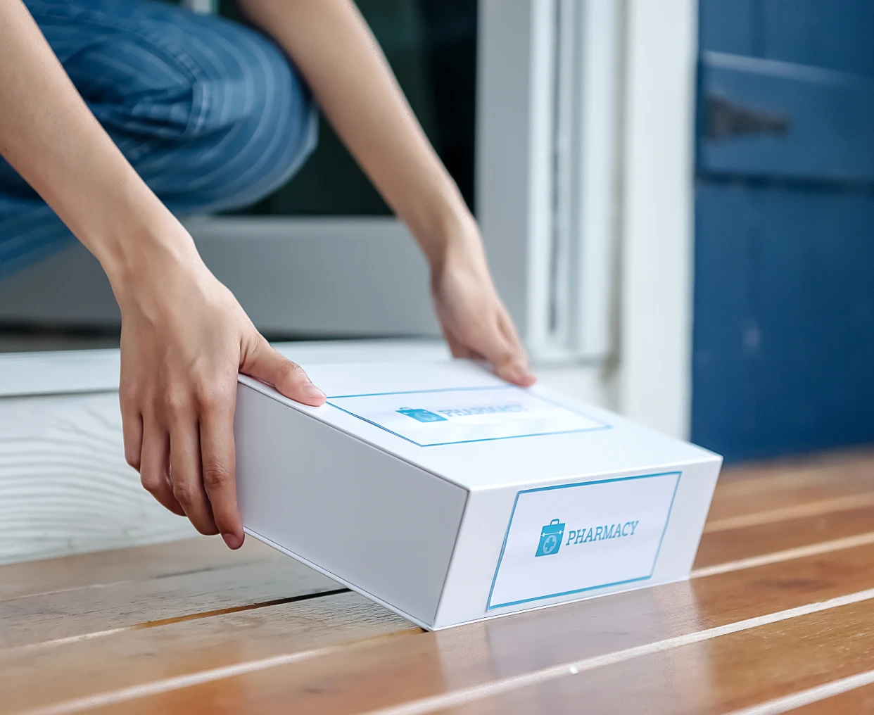 Hands reaching for a delivery box